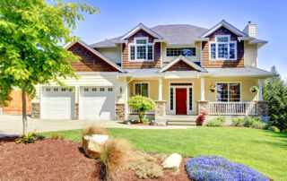 Large American beautiful house with red door. exterior house painting temperature