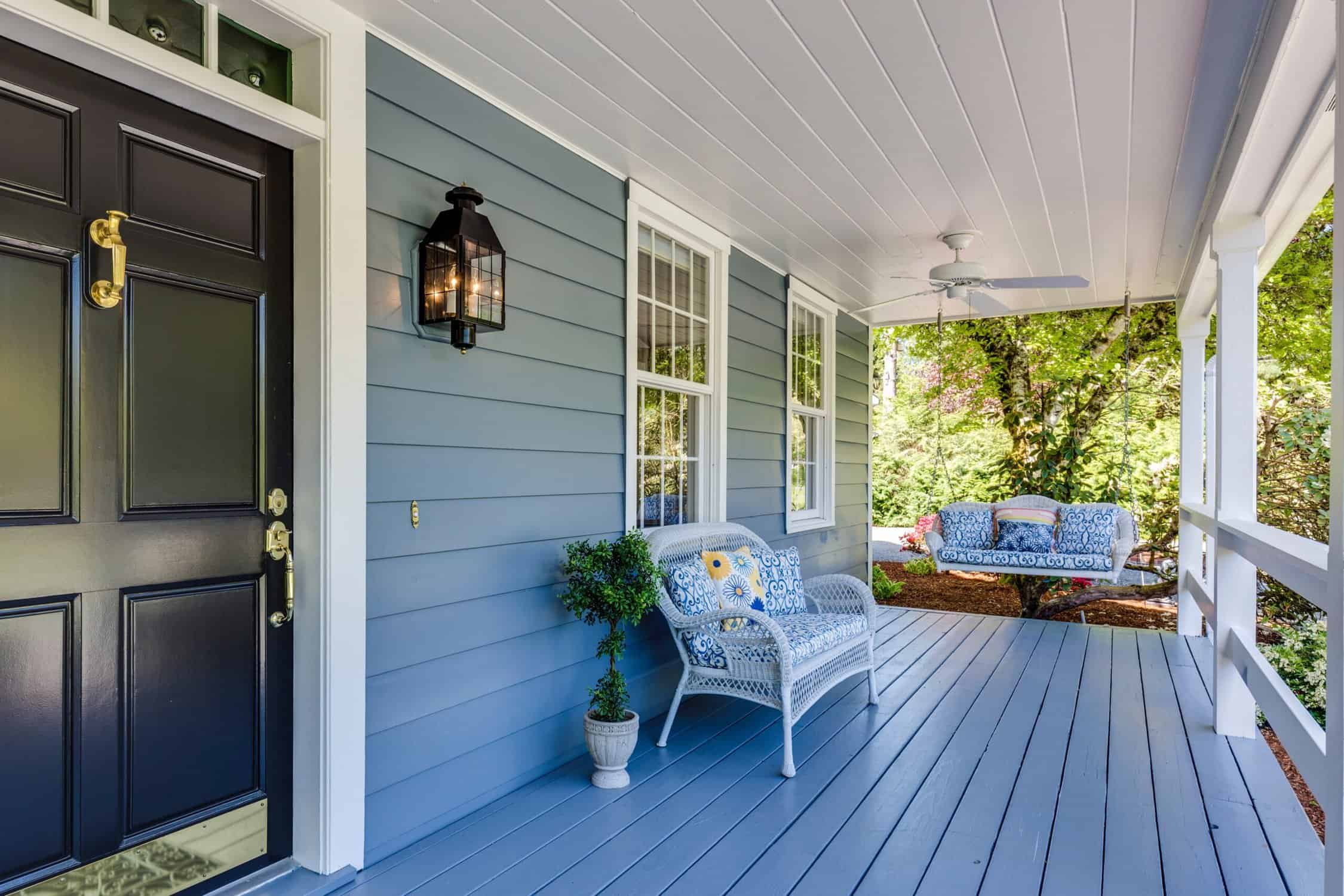 Blue coastal-inspired deck with overlooking garden.

exterior house painting temperature
