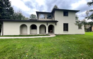 White stucco walls on a large house how weather impacts exterior painting